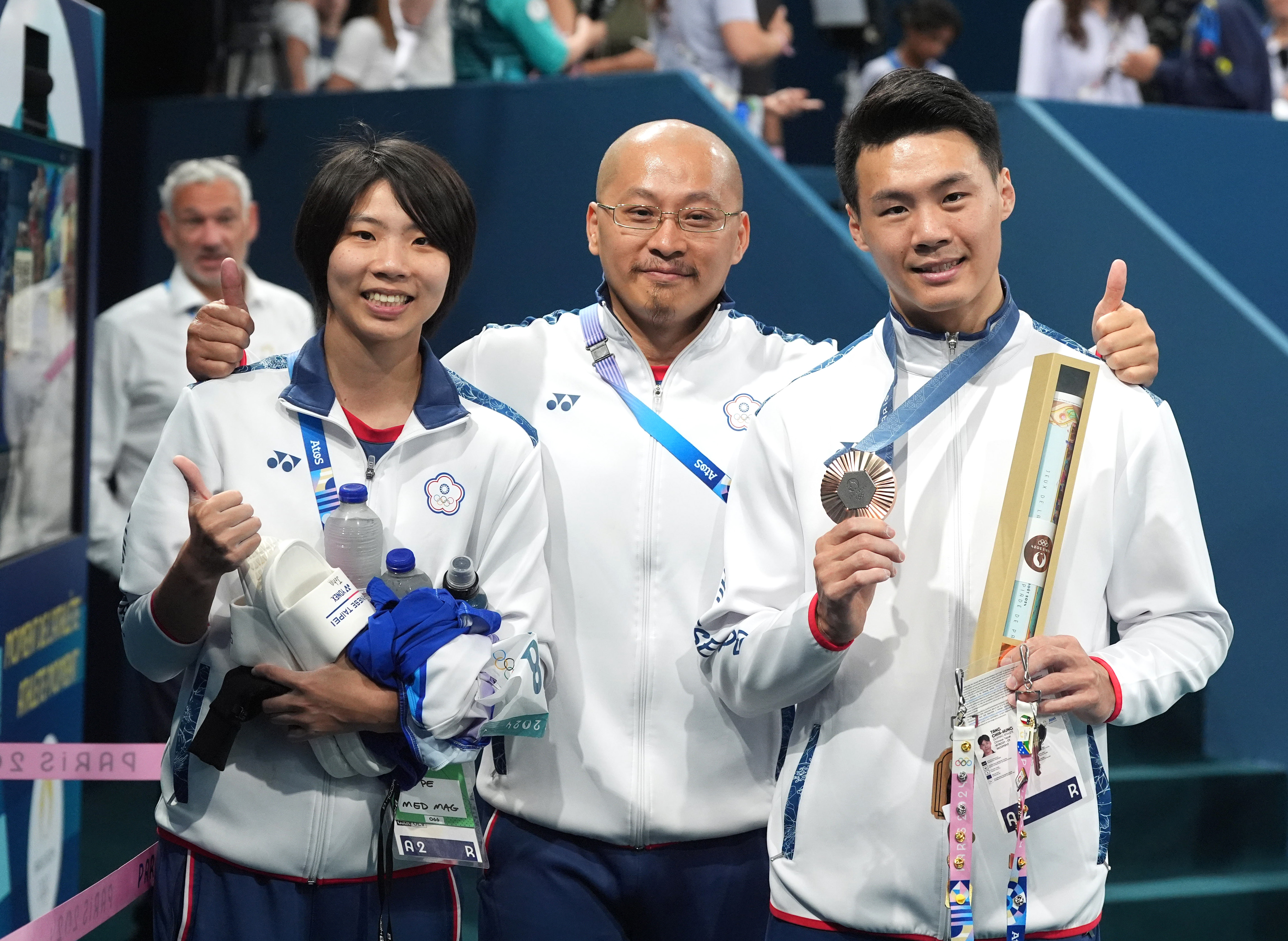(圖)Gymnast Tang Chia-hung (right), coach Weng Shi-hang (middle), and athletic trainer Fan Chieh-ting.
